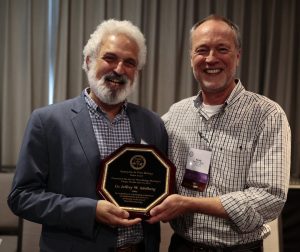 Jeffrey Adelberg (left) accepting the 2019 Fellow Award from Plant Biotechnology Chair, Randall Niedz (right).